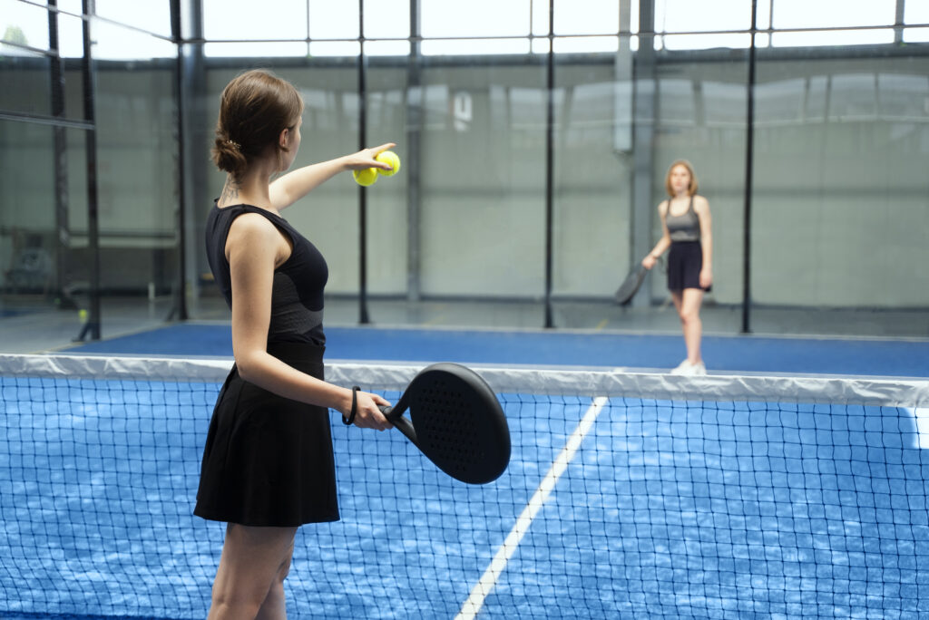 women-playing-paddle-tennis-side-view